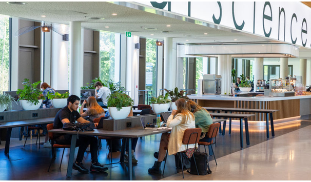 Light-filled interior of the Maria Montessori Building, designed for collaboration and study.